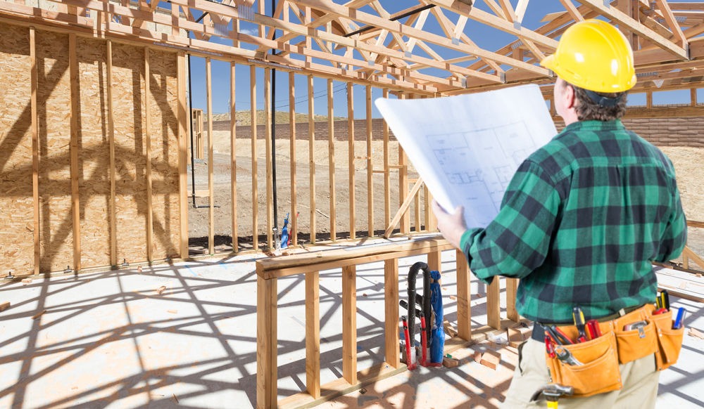 Remodeling contractor reviewing project job site